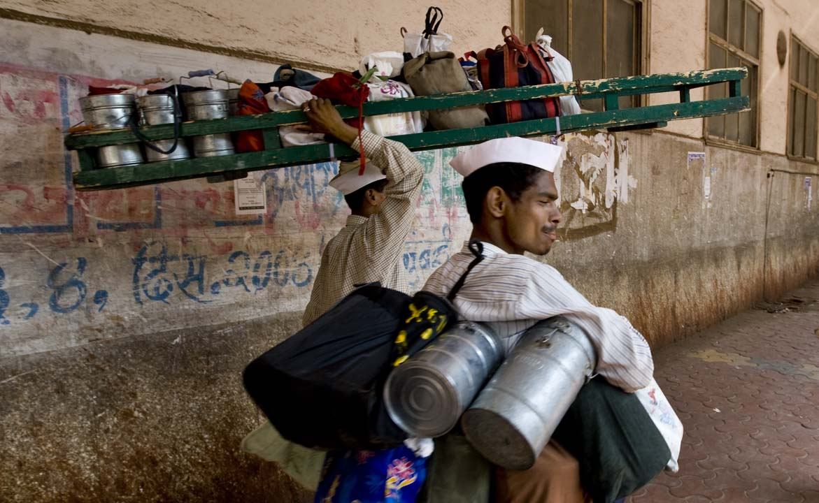 Traditional tiffin carrier delivery, representing the home-style tiffin tradition