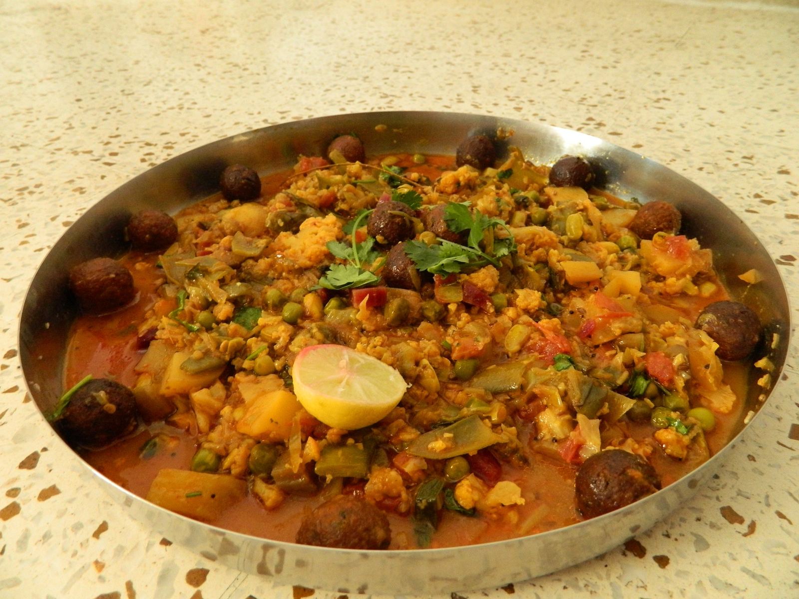 Bowl of Undhiyu, a mixed vegetable festive Gujarati dish, top-down view